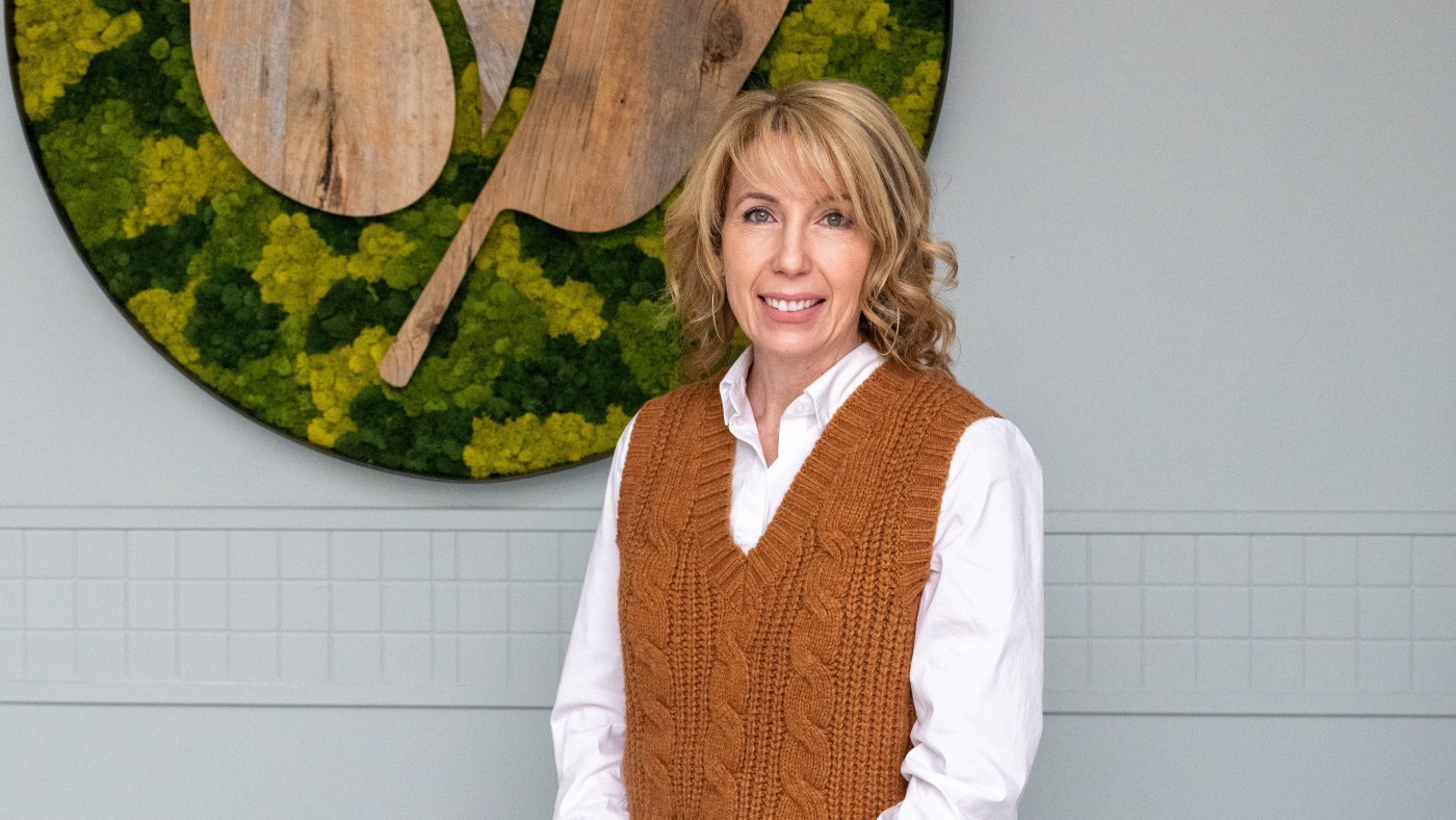 New SPA Chair April Jeffs stands in front of the NPCA logo