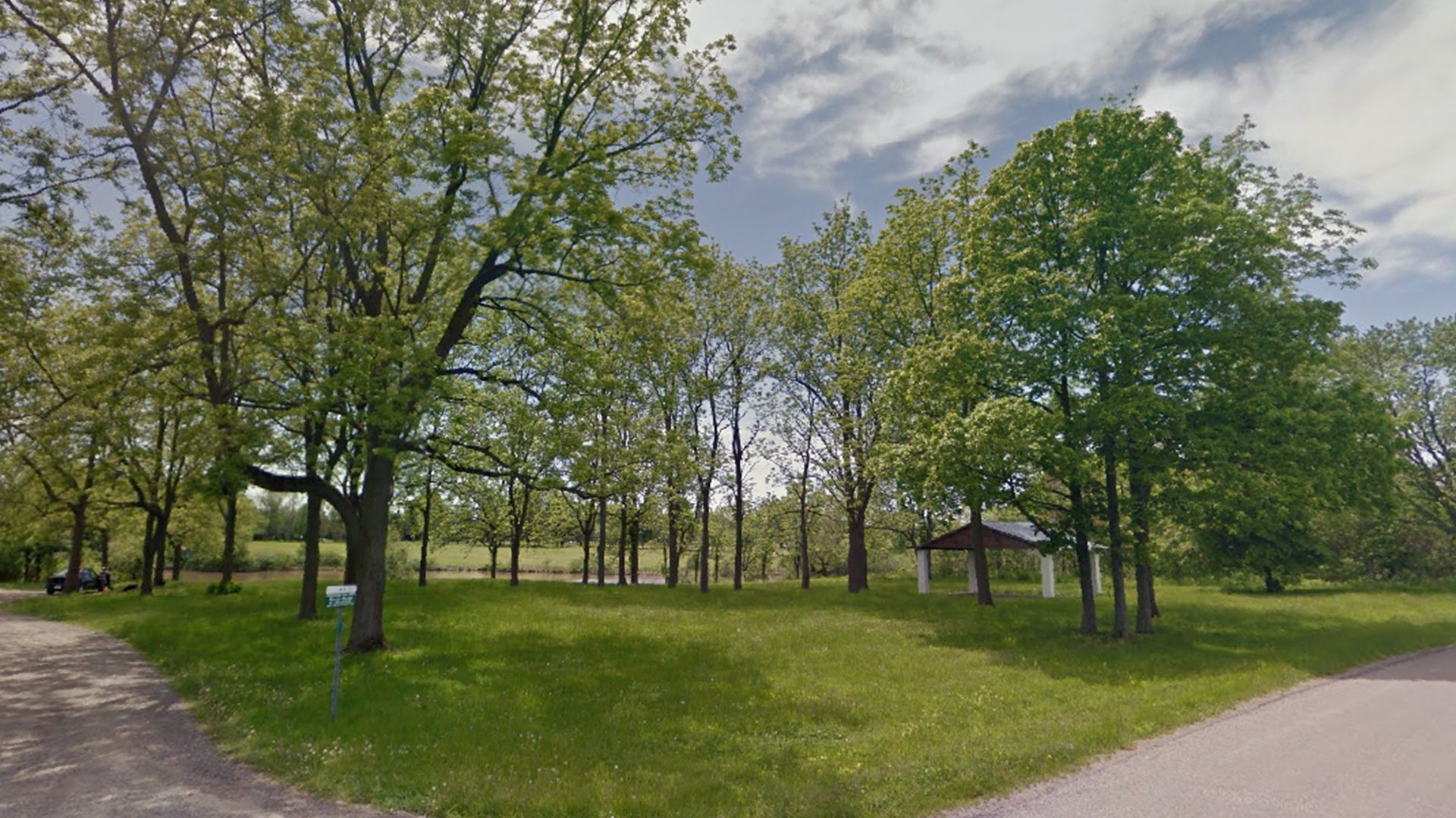 Interior of park with trees and pavilion