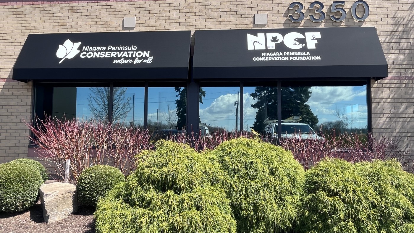 Photo of the front entrance at NPCA new office with logos 