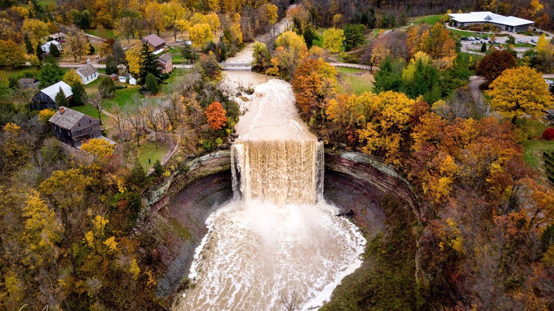 Aerial photo of the lower waterfall surrounded by fall colours and leaves 