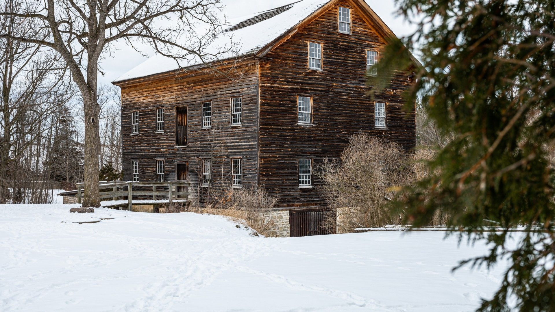 Heritage mill in the Glen Elgin village surrounded by snow.