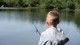 Boy fishing in lake 