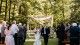 Couple holds hands as they leave their wedding ceremony
