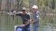 Father and son show fish just caught at St. Johns pond 