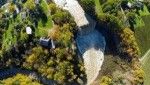 An aerial shot of the Lower Falls, the heritage village is visible on the side.