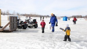 kids and adults on the ice, fishing