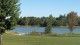 Scenic photo of Binbrook Conservation Area, trees and grass